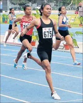  ?? BHARAT SHARMA/HT ?? Hima Das on way to clinching the 400m gold at the Federation Cup in Patiala on Monday.