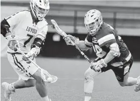  ?? AMY DAVIS/BALTIMORE SUN ?? Loyola Maryland attackman Pat Spencer, picking up a ground ball last season, picked up right where he left off with a stellar opening game in 2019.