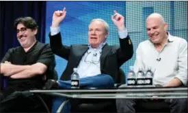  ??  ?? Actor Alfred Molina, left, and writer David Simon, right, smile while listening to writer/ executive producer William F. Zorzi speak onstage during the “Show Me a Hero” panel at the HBO 2015 Summer TCA Tour in Beverly Hills, Calif.