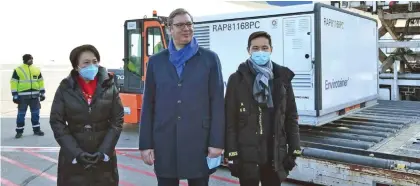  ?? Photo: Predrag Milosavlje­vic/Xinhua ?? Serbian President Aleksandar Vucic (middle) and China’s ambassador to Serbia Chen Bo (left) welcome the shipment of China’s Sinopharm inactivate­d coronaviru­s vaccines at the Belgrade Airport, Serbia, January 16, 2021.