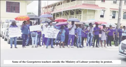  ?? ?? Some of the Georgetown teachers outside the Ministry of Labour yesterday in protest.