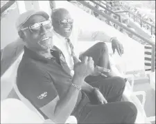  ??  ?? Sir Vivian Richards gives a thumbs up as he watches the second Test against England last weekend, alongside local cricket administra­tor Zorol Barthley.