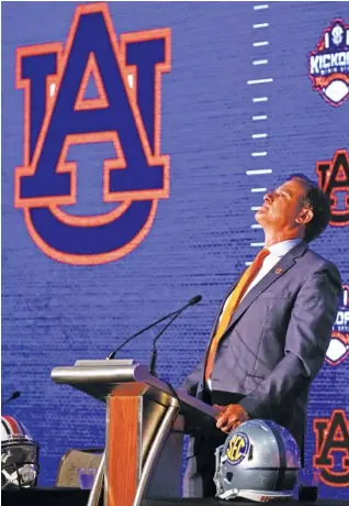  ?? AP PHOTO/BUTCH DILL ?? Auburn football coach Gus Malzahn speaks Thursday at SEC Media Days in Hoover, Ala. Malzahn is the league’s only current coach with a head-to-head win against Nick Saban, but his job status appears shaky after the Tigers went 3-5 in SEC play with a lopsided loss to Alabama last season.