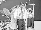  ?? COURTESY OF UCF COLLEGE OF MEDICINE ?? Former UCF soccer player Kyle Cox receives his white coat from Dean Deborah German during the medical school’s White Coat ceremony. The ceremony was canceled this year because of the pandemic.