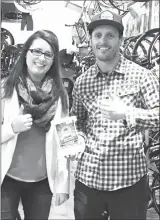  ?? Special to The Herald ?? Theresa Fuller, business banking advisor with Valley First, delivers a Fan Choice Award to Will Pratt, coowner of The Bike Barn, a Penticton-based business that was recognized in the Best Transporta­tion category.