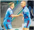  ??  ?? Kenny Miller (right) celebrates his goal