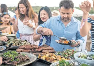  ??  ?? Customers enjoy a feast at an event for the Margaret River Gourmet Escape.