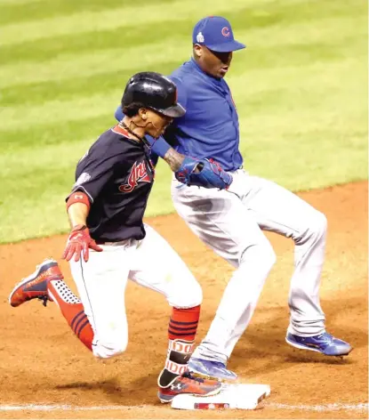  ?? | EZRA SHAW/ GETTY IMAGES ?? Aroldis Chapman beats the Indians’ Francisco Lindor to first base for the final out of the seventh inning.