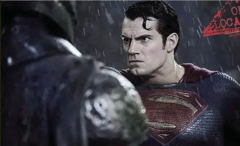  ??  ?? Even in the pouring rain, Superman’s hair is on fleek.