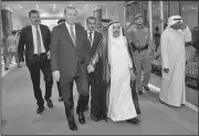  ?? AP ?? Turkey’s President Recep Tayyip Erdogan (second left) walks Sunday with Kuwait’s emir, Sheikh Sabah Al Ahmad Al Sabah (center) before their meeting in Kuwait City.