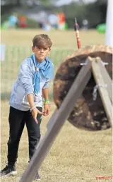  ?? ?? Axe-throwing at Detling showground for the Kent Internatio­nal Jamboree