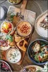  ?? COURTESY OF FRANKIE COLE ?? Ela’s mezze board includes Persian labneh, smoked eggplant dip, your choice of hummus, pickles and grilled pita.