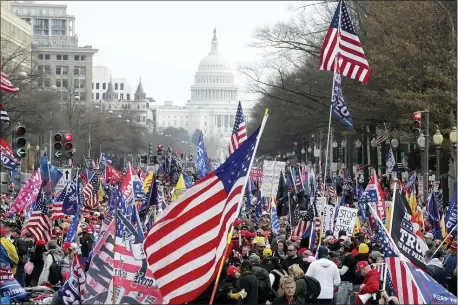  ?? LUIS M. ALVAREZ — THE ASSOCIATED PRESS ?? With the U.S. Capitol building in the background, supporters of President Donald Trump stand Pennsylvan­ia Avenue during a rally at Freedom Plaza, Saturday, Dec. 12, 2020, in Washington.