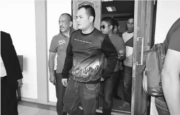  ??  ?? Choo leaves the Sessions Court after he was freed on RM5,000 bail.