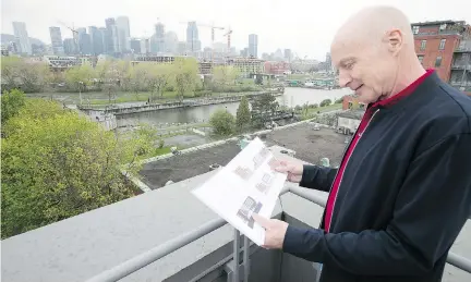  ?? PIERRE OBENDRAUF ?? John Gutpell, a board member at the Corticelli Lofts, studies plans for a planned six-storey office building. Some residents, Gutpell says, “are going to have office workers looking directly into their apartments.”