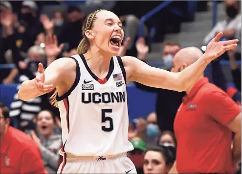  ?? Jessica Hill / Associated Press ?? UConn’s Paige Bueckers reacts after making her first basket after returning from injury in the first half against St. John’s on Friday night at XL Center in Hartford.