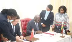  ?? ?? First Lady Dr Auxillia Mnangagwa (right) looks on while Local Government and Public Works Minister July Moyo and Chinese Ambassador to Zimbabwe Guo Shaochun (left) sign the certificat­es during the handover of Covid-19 vaccines at State House in Harare yesterday. — Pictures Innocent Makawa