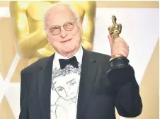  ?? — AFP file photo ?? Ivory poses in the press room with the Oscar for Best Adapted Screenplay for ‘Call Me by Your Name,’ during the 90th Annual Academy Awards On March 4, 2018.