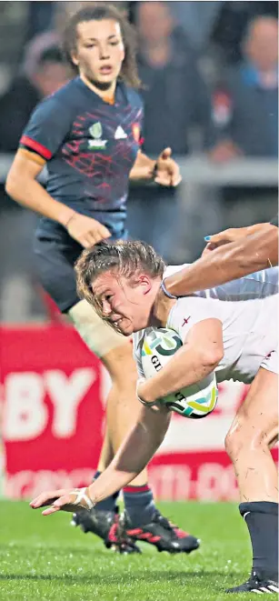  ??  ?? Belfast battle: England’s young prop Sarah Bern is tackled by Safi N’diaye