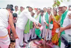  ??  ?? Chief Minister K. Chandrasek­har Rao pours water to a sapling he planted at the Lower Manair Dam to kick off Haritha Haram-III, near Karimnagar.