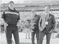  ?? PHELAN M. EBENHACK/AP ?? Decisions, decisions: Jaguars coach Doug Marrone, from left, executive vice president of football operations Tom Coughlin and general manager David Caldwell face major changes in Jacksonvil­le after this season’s disappoint­ing campaign.