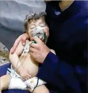  ?? SYRIAN CIVIL DEFENSE WHITE HELMETS / ZUMA PRESS ?? In this image from video released by the Syrian Civil Defense, a medical worker treats a toddler following an alleged poison gas attack in the opposition-held town of Douma, in eastern Ghouta. The suspected chemical attack killed at least 40 people.