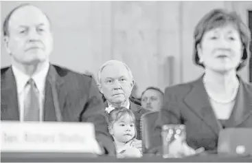  ?? Andrew Harnik / Associated Press ?? Attorney General-designate, Sen. Jeff Sessions, R-Ala., holds one of his granddaugh­ters between Sen. Richard Shelby, R-Ala., left, and Sen. Susan Collins, R-Maine, right, on Capitol Hill in Washington.