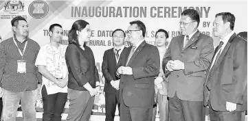  ??  ?? Nanta (fourth, right) having a light moment with Asean Secretaria­t Ajeng Purnama Pratiw during the inaugurati­on ceremony of the fifth Asean+3 Village Leaders Exchange Programme yesterday. Also present was Rural and Regional Developmen­t Ministry...