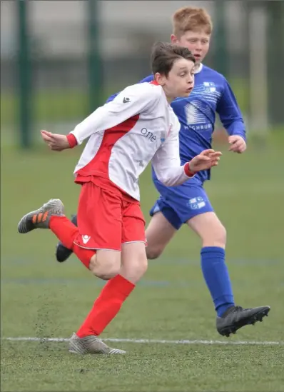  ??  ?? Shea Neary makes a break up the left wing for Rock Celtic against Muirhevnam­ór.