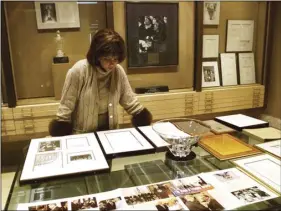  ??  ?? In this Dec. 10, 2001, file photo, Linda Johnson Rice, president and chief operating officer of Jet magazine, looks over awards and recognitio­ns won by the magazine in its 50-year lifetime at Jet’s Chicago headquarte­rs. AP PHOTO/TED S. WARREN