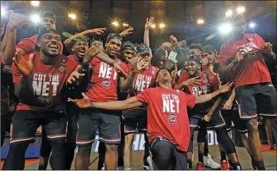  ?? Associated Press ?? Going dancing: South Carolina players celebrate after beating Florida 77-70 in the East Regional championsh­ip game Sunday in New York.