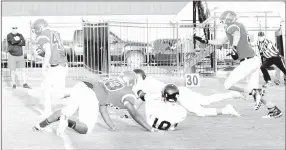  ?? MARK HUMPHREY ENTERPRISE-LEADER ?? Farmington eighth-grader Trey Hill (No. 40) takes off for the end zone after scooping up a fumble on the second play from scrimmage. Hill scored on defense as Farmington defeated the junior Blackhawks 32-0 Sept. 14 in nonconfere­nce junior high football...