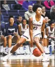  ?? Stephen Dunn / Associated Press ?? UConn’s Christyn Williams controls the ball during the second half against Cincinnati Wednesday in Storrs.