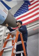  ?? [PHOTOS PROVIDED BY SKYWEST] ?? RIGHT: A mechanic works on a SkyWest aircraft at one of its maintenanc­e centers. ABOVE: SkyWest operates 410 aircraft in its fleet.