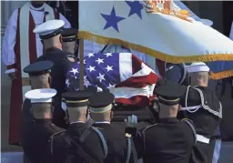  ?? MANUEL BALCE CENETA/AP ?? The flag-draped casket of former Secretary of State Colin Powell is carried into the Washington National Cathedral on Friday.