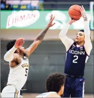  ?? Matt Slocum / Associated Press ?? UConn’s James Bouknight (2) goes up for a shot against Villanova’s Justin Moore during the second half on Saturday.