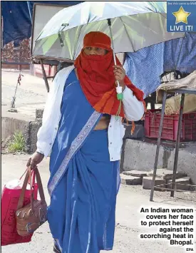  ??  ?? An Indian womancover­s her face to protect herselfaga­inst the scorching heat inBhopal.