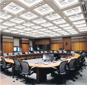  ??  ?? Along with the main chamber, the West Block features smaller, more intimate settings for the work of MPs such as this committee room.