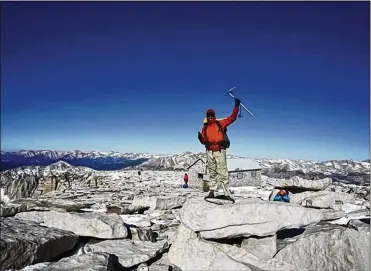  ?? CONTRIBUTE­D BY JEFF TIPPETT ?? Eddie Boyd celebrates atop California’s Mount Whitney, the highest peak in the contiguous United States. Boyd said he encountere­d many rattlesnak­es, but also plenty of friendly hikers, on the 2,650-mile hike.