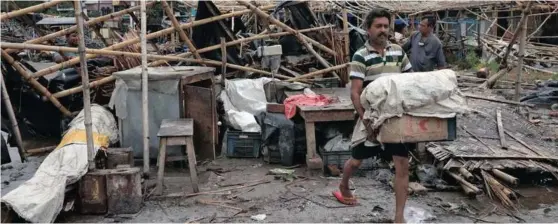  ?? | Reuters ?? CYCLONE Amphan pounded eastern India and Bangladesh this week, killing dozens of people and destroying thousands of homes, officials said, leaving authoritie­s struggling to mount relief efforts amid a surging Covid-19 outbreak.