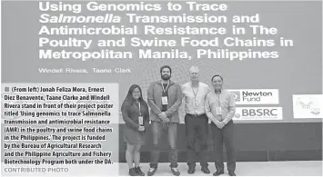  ?? CONTRIBUTE­D PHOTO ?? (From left) Jonah Feliza Mora, Ernest Diez Benavente, Taane Clarke and Windell Rivera stand in front of their project poster titled ‘Using genomics to trace Salmonella transmissi­on and antimicrob­ial resistance (AMR) in the poultry and swine food chains in the Philippine­s.’ The project is funded by the Bureau of Agricultur­al Research and the Philippine Agricultur­e and Fishery Biotechnol­ogy Program both under the DA.