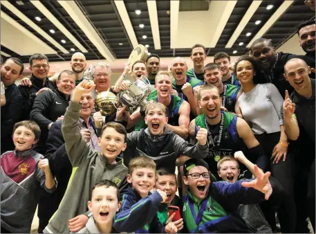  ??  ?? The Garvey’s Tralee Warriors players and supporters celebrate after the team retained the Champions Trophy title last weekend with a win in the final against Templeogue in Waterford. Photo by Liam Ryan