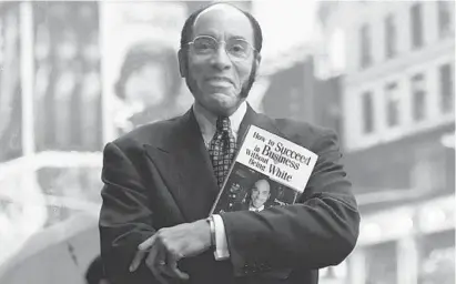  ?? BEBETO MATTHEWS/AP ?? This Aug. 17, 1997 file photo shows Earl G. Graves Sr. with his book “How To Succeed In Business Without Being White” in New York.