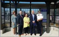  ?? DAN SOKIL — FOR DIGITAL FIRST MEDIA ?? Lansdale Borough officials pose inside the new Railroad Avenue bus station after a ceremony to mark the formal opening of the station on Thursday. From left to right are Chamber of Greater Montgomery County CEO Pam Kelly, council President Denton Burnell, council Vice President Mary Fuller, SEPTA General Manager Jeff Knueppel and Lansdale police Chief Michael Trail.