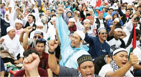 ??  ?? Protesters shout slogans during Sunday’s rally in Jakarta against the US recognitio­n of Jerusalem as Israel’s capital in Jakarta on Sunday. (AP)