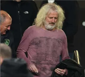  ??  ?? Still a loyal supporter... Mick Wallace making his way to his seat in the Aviva Stadium before Ireland’s clash with Denmark last November.