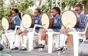  ??  ?? MBIRA QUEENS . . . Grade Two pupils from The Heritage School (from left) Nicole Sambo, Myesha Chiwanga, Ruvarashe Mukarakate and Mufaro Matsika play mbira at a schools arts extravagan­za at Harare Polytechni­cal College last week . The group was crowned...