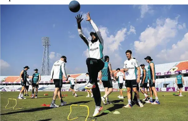 ??  ?? FULL STRETCH: England’s Adil Rashid warms up during a nets session at Zohur Ahmed Chowdhury Stadium in Chittagong, Bangladesh
