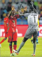  ?? Picture: REUTERS ?? JOB WELL DONE: Guinea-Bissau’s Juary Soares and Jonas Mendes celebrate drawing with Gabon