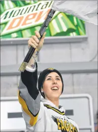  ?? T.J. COLELLO/CAPE BRETON POST ?? Screaming Eagles supporter Jessica MacDonald waves her flag after a firstperio­d goal by Adam McCormick.